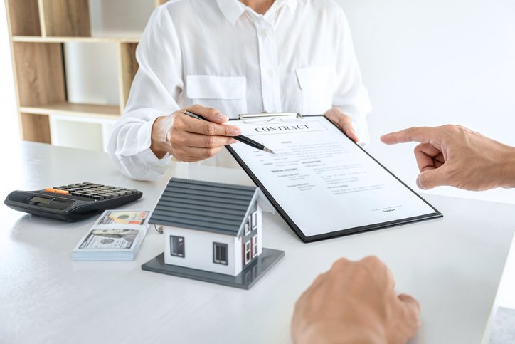 A commercial real estate investor reviewing a contract for a bridge loan.