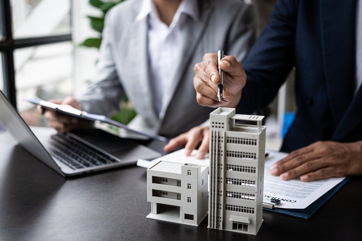 Investors reviewing their real estate portfolio.